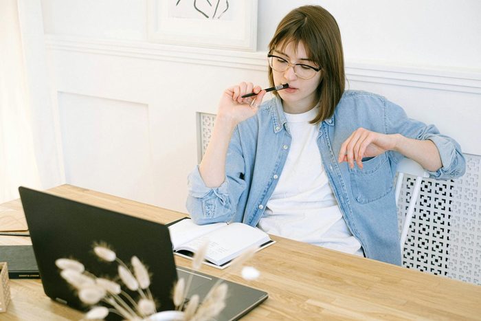 A woman learning to manage her money at her laptop